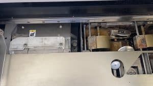 Adhesive glue tank in a perfect binding machine